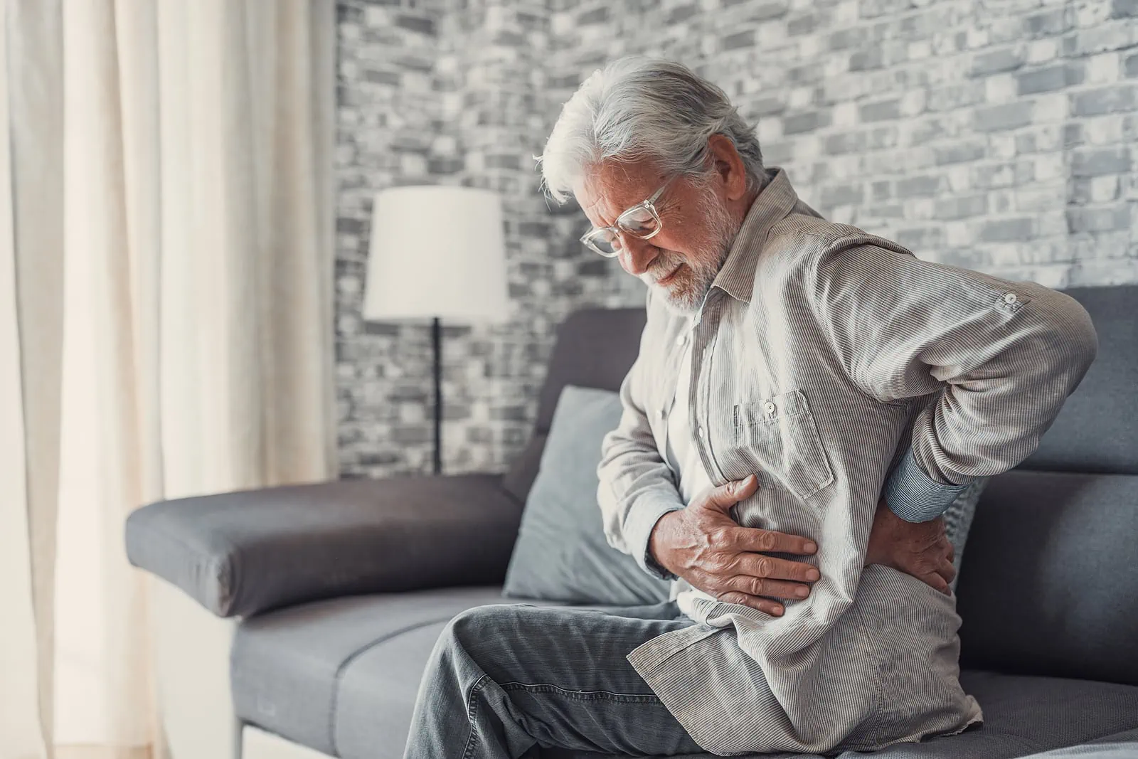 Upset Senior Man Feel Sudden Back Pain Muscles Ache from osteoporosis